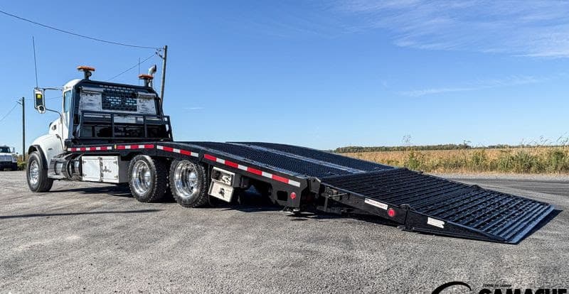 Tow truck in Thunder Bay loading equipment